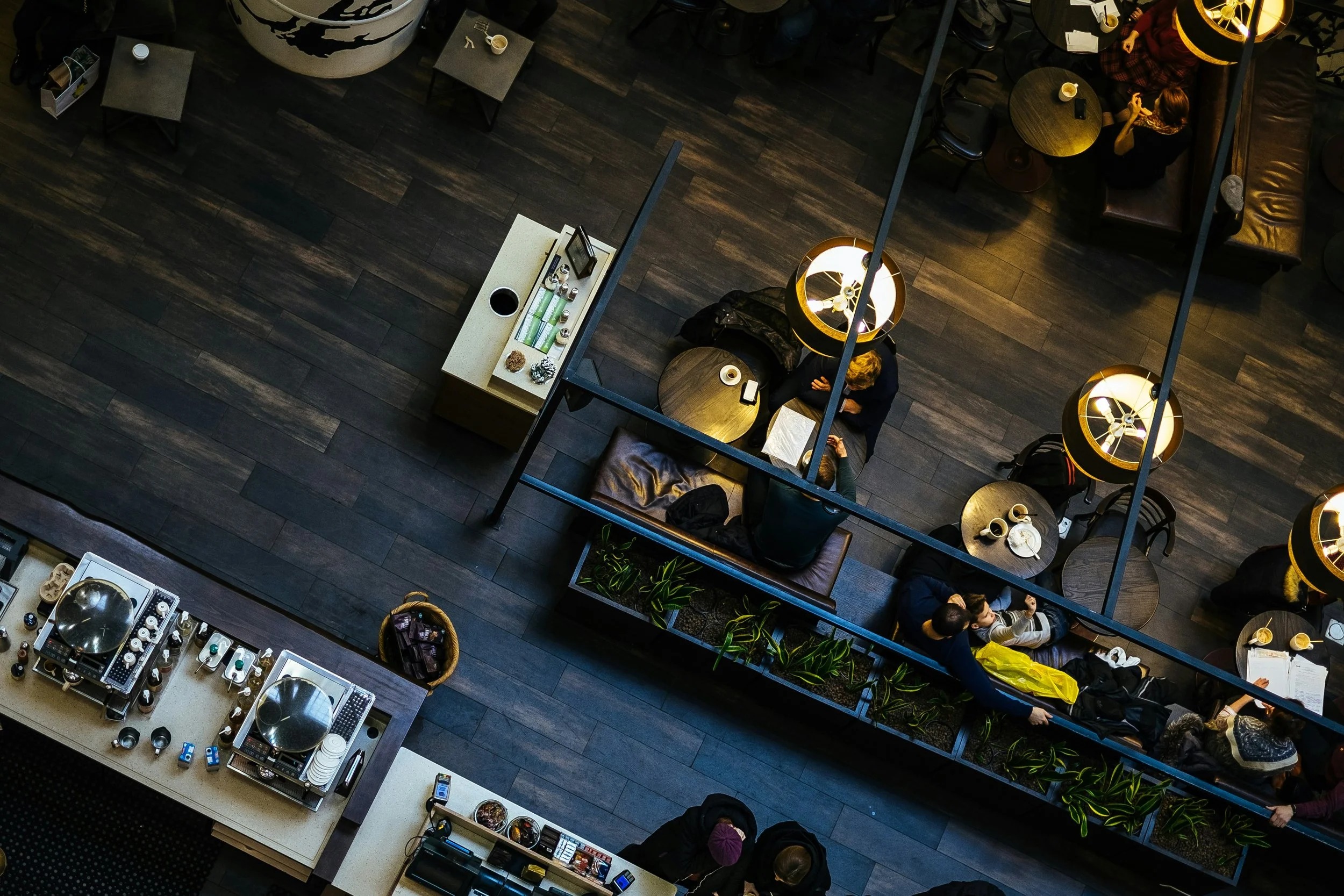 An overhead café photograph illustrating a shared-space camera view